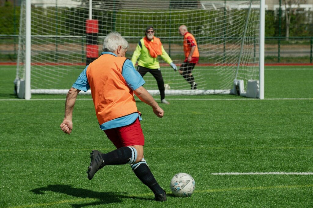 A group of people playing a game of soccer